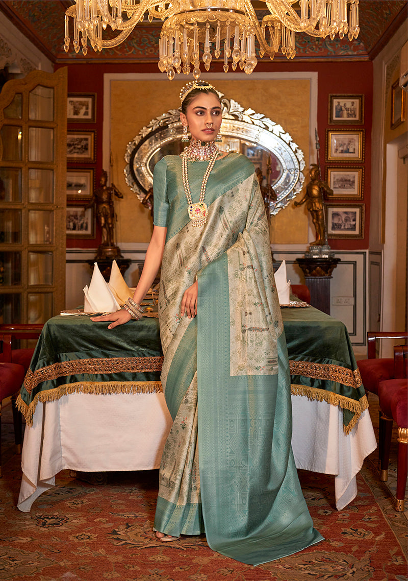 Light turquoise Tussar silk saree with digital floral print and a gold zari border