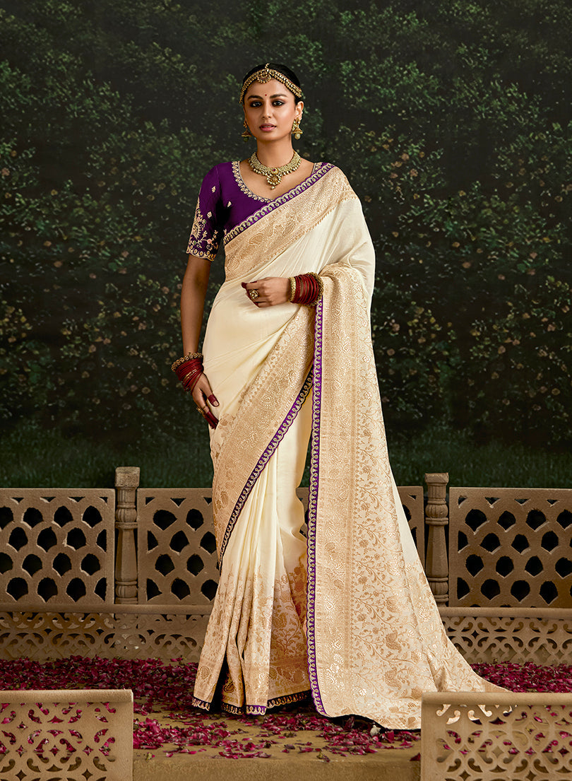 Cream dola silk saree with intricate sequins border work for formal occasions