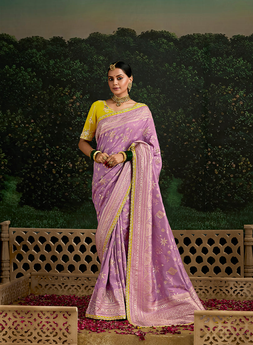 Lilac dola silk saree with intricate sequins embroidery on the border.