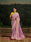 Lilac dola silk saree with intricate sequins embroidery on the border.