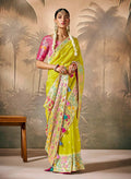 Lime-green and pink silk saree with floral pattern and gold zari work