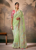 Light green contemporary silk saree adorned with floral Zari work