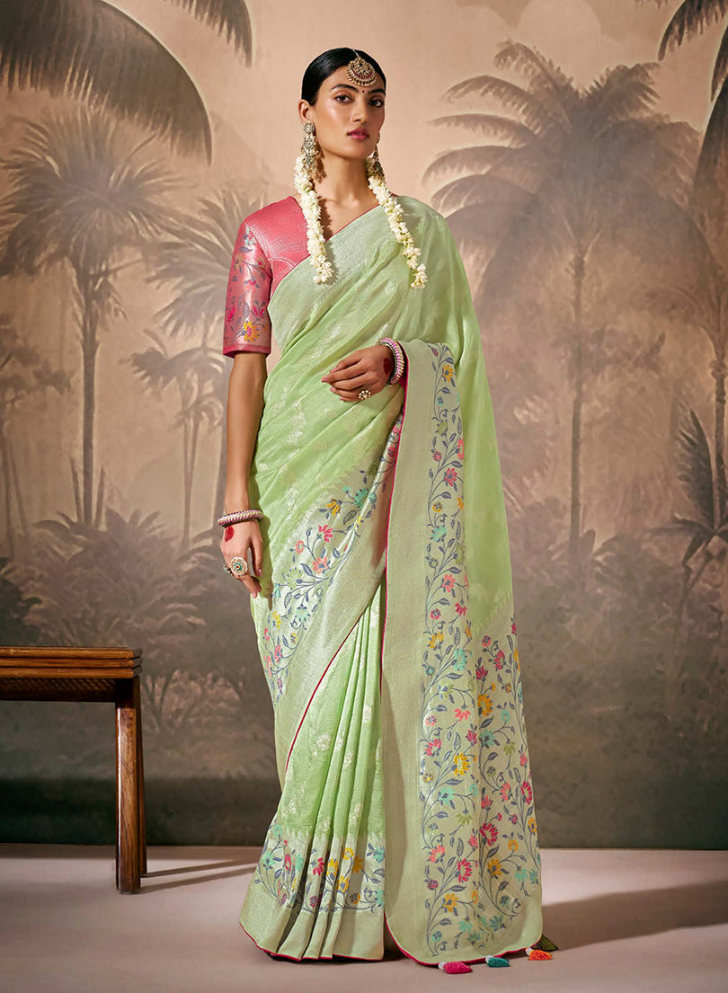 Light green contemporary silk saree adorned with floral Zari work