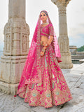 A beautiful Rani Pink silk lehenga choli with detailed Zari and sequin embroidery.