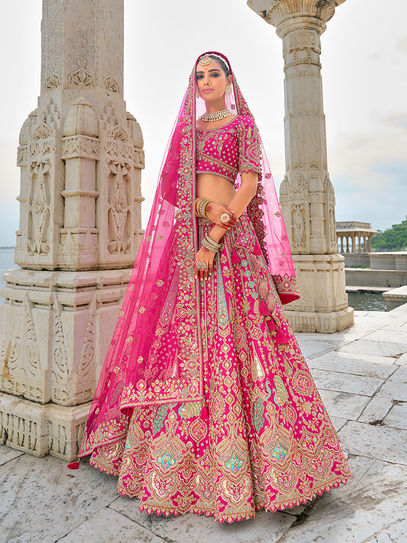 A beautiful Rani Pink silk lehenga choli with detailed Zari and sequin embroidery.