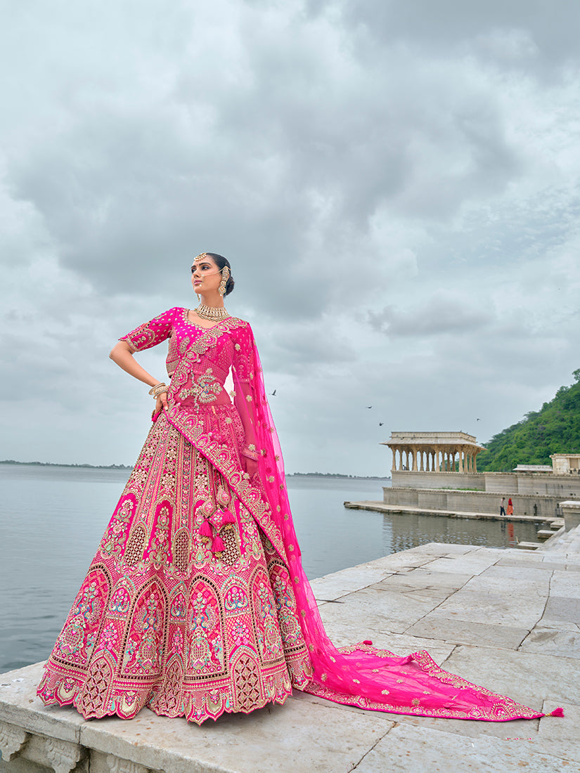 Rani Pink silk bridal lehenga with detailed sequin and Zari embroidery.