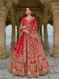 Classic red silk bridal lehenga choli featuring intricate ethnic embroidery and zari work.