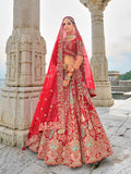 Red silk bridal lehenga choli with ornate sequins and Zari embroidery
