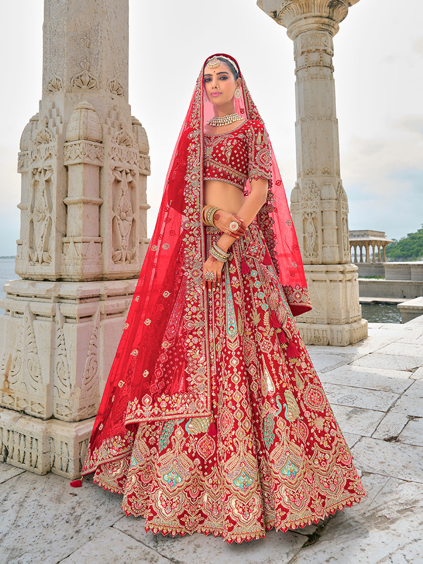 Red silk bridal lehenga choli with ornate sequins and Zari embroidery