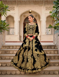 Elegant black velvet lehenga choli with intricate stone work and embroidery detailing for weddings