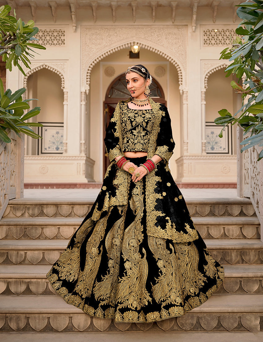 Elegant black velvet lehenga choli with intricate stone work and embroidery detailing for weddings