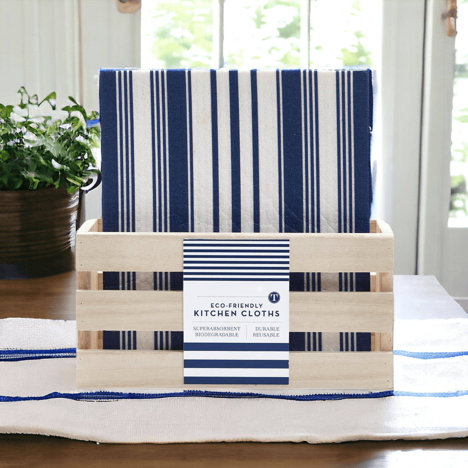 Set of blue and white striped biodegradable kitchen cloths displayed in a wooden holder
