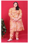 Model wearing a vibrant orange floral print rayon co-ord set with 42-inch length kurta