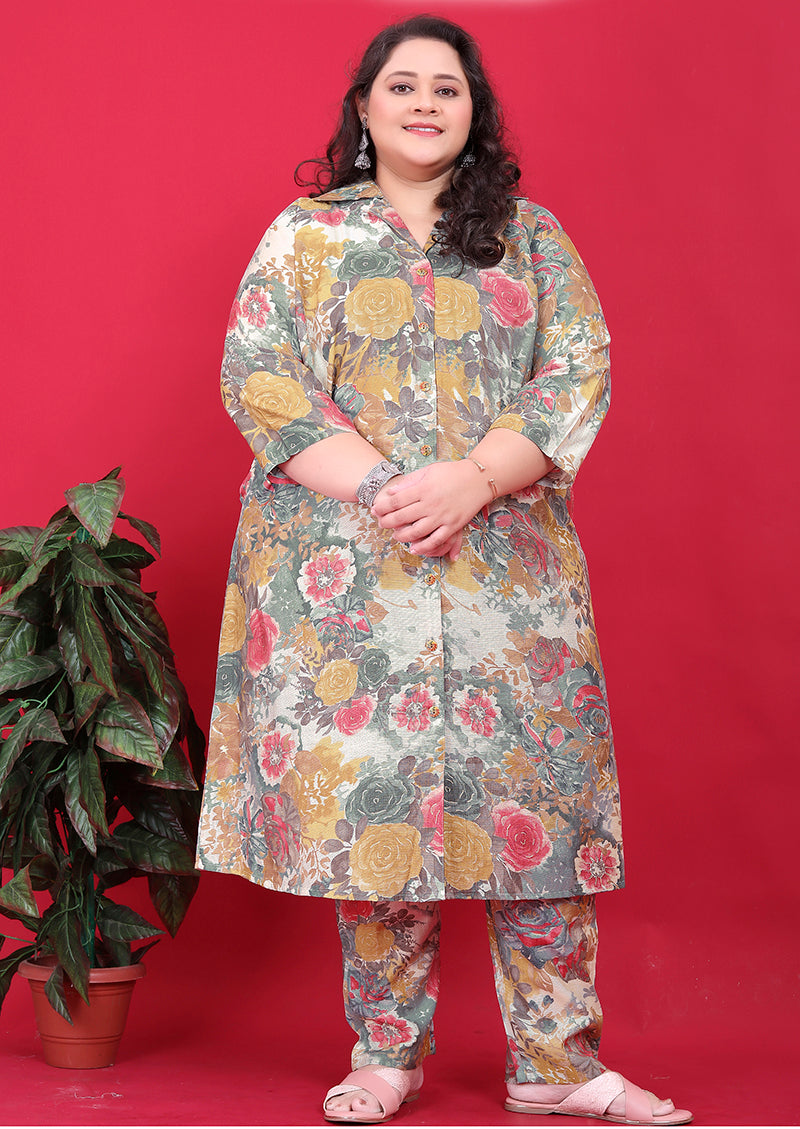 Woman wearing a multicolor rayon floral print co-ord set with collared button-down top and matching bottoms.