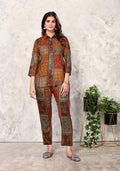 Model wearing a Brown Premium Rayon Floral Printed collared shirt and matching pants co-ord set.