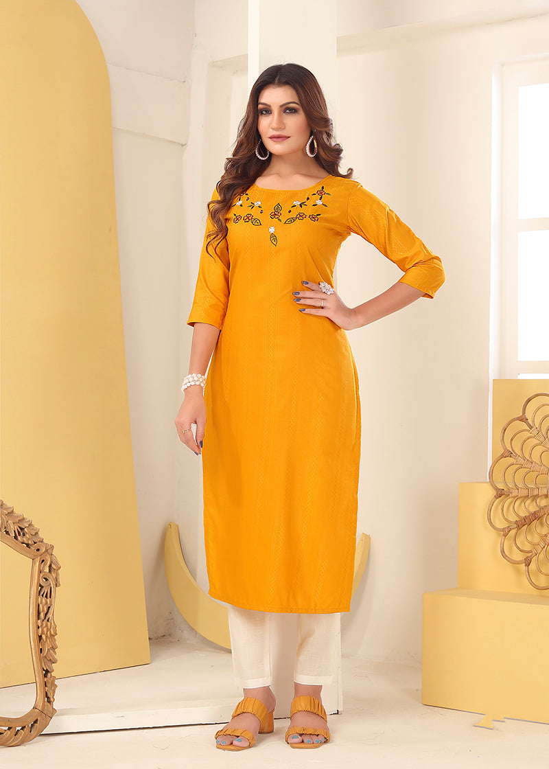 Mustard colored Vision silk kurti adorned with detailed handmade embroidery