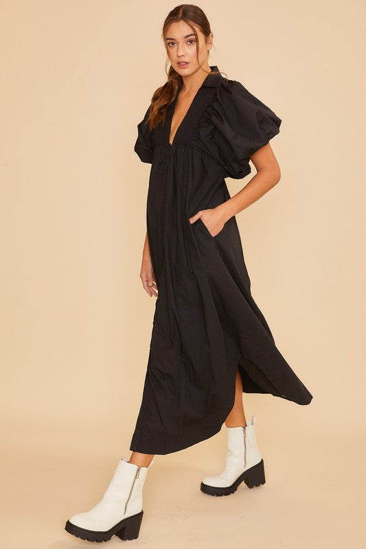 Elegant black midi dress with puff sleeves and smocked detailing