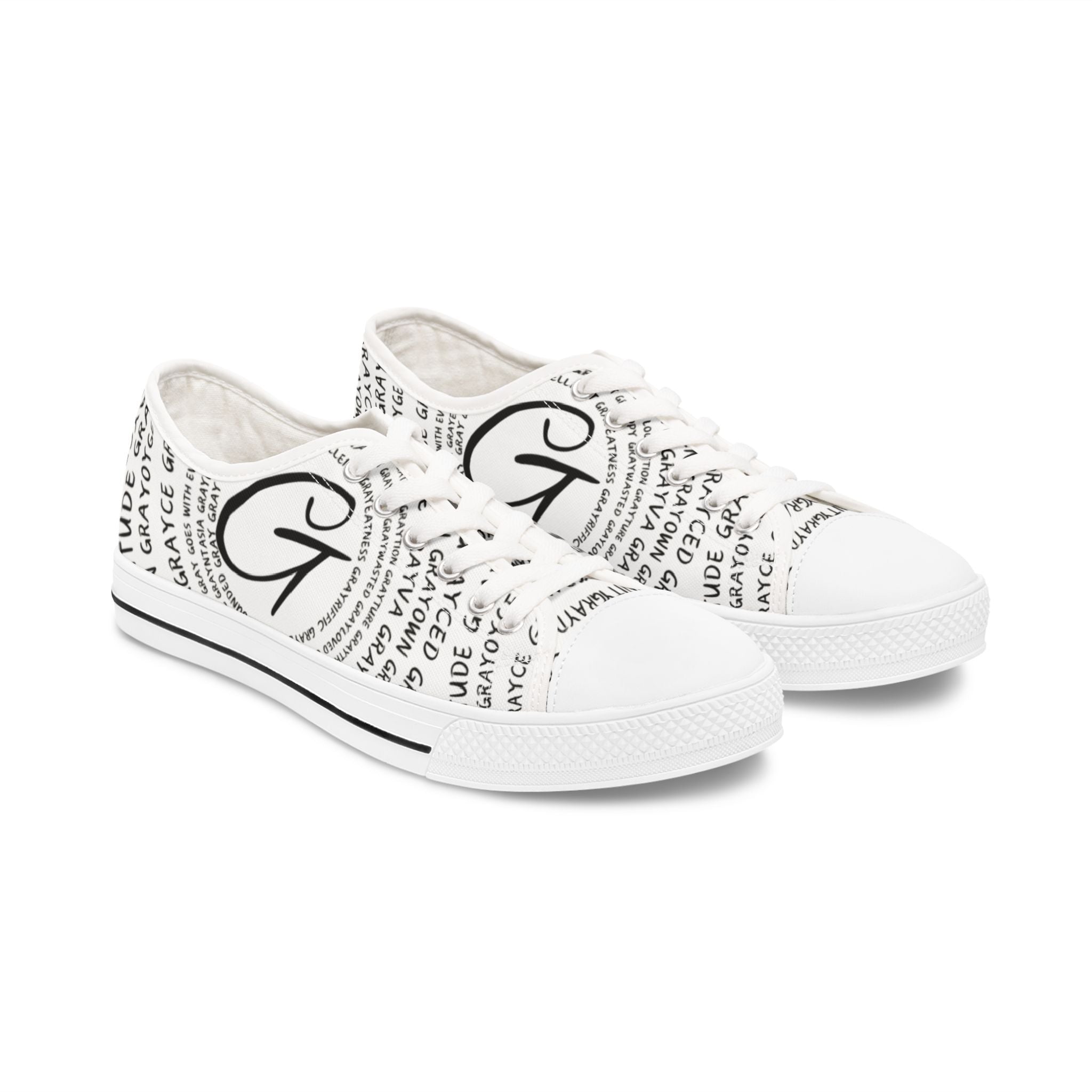 Monochrome black and white cotton low top sneakers with logo typography and lace-up closure