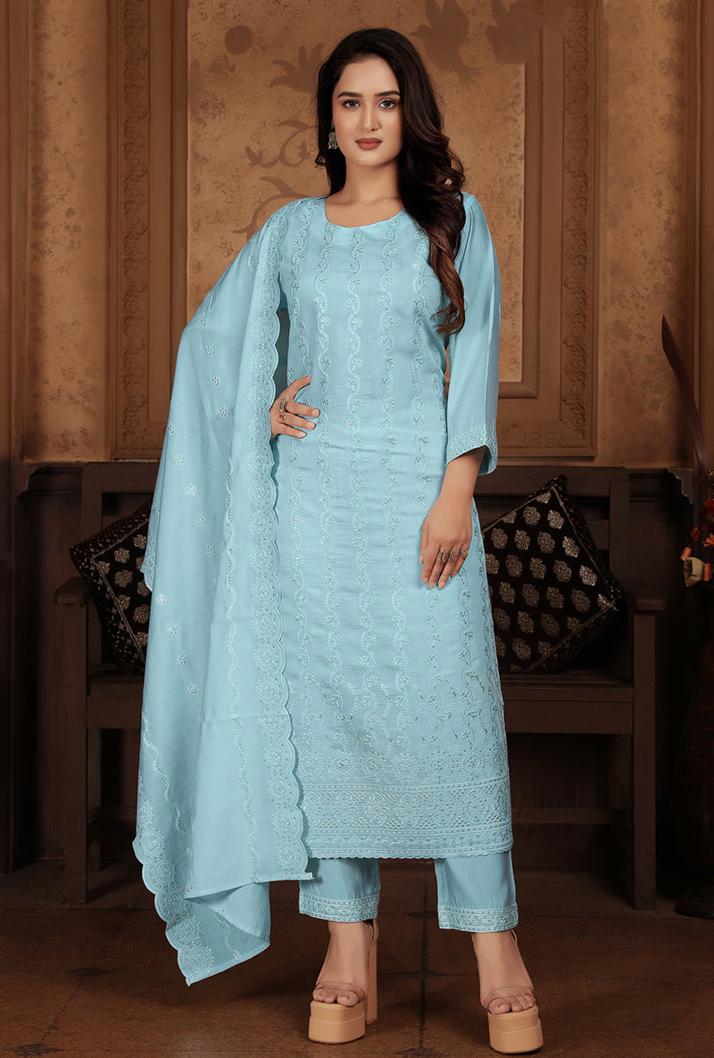 Light blue Chanderi suit featuring heavy floral sequence embroidery and a formal silhouette