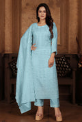 Light blue Chanderi suit featuring heavy floral sequence embroidery and a formal silhouette
