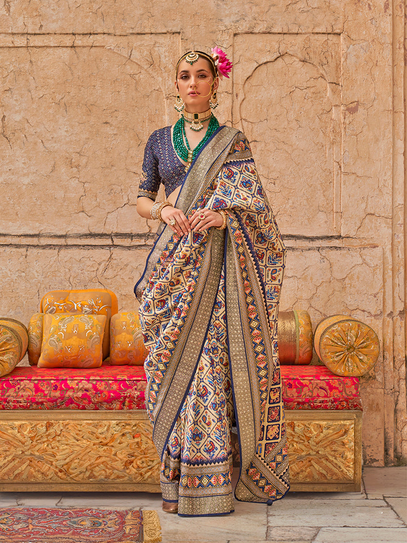 Classic cream colored saree with delicate prints in viscose silk fabric