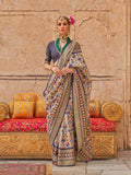 Classic cream colored saree with delicate prints in viscose silk fabric