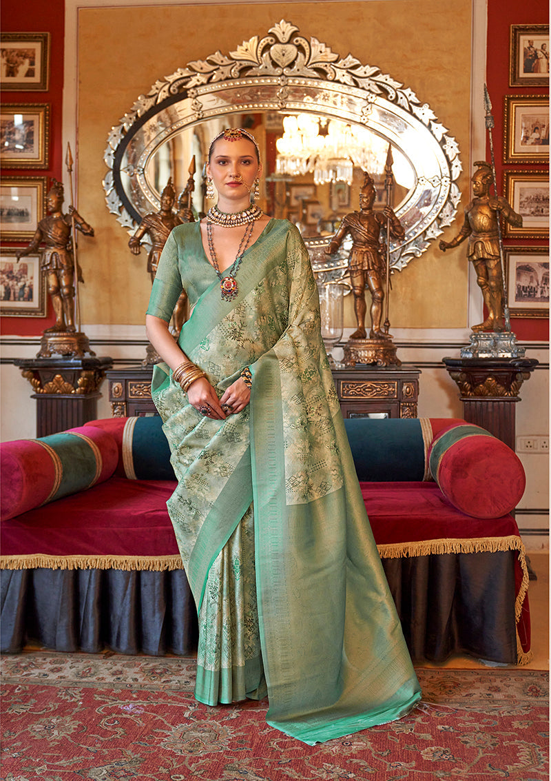 Cream and sea green Tussar silk saree with digital print and zari border