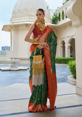Dark green Banarasi silk saree with intricate gold weaving work