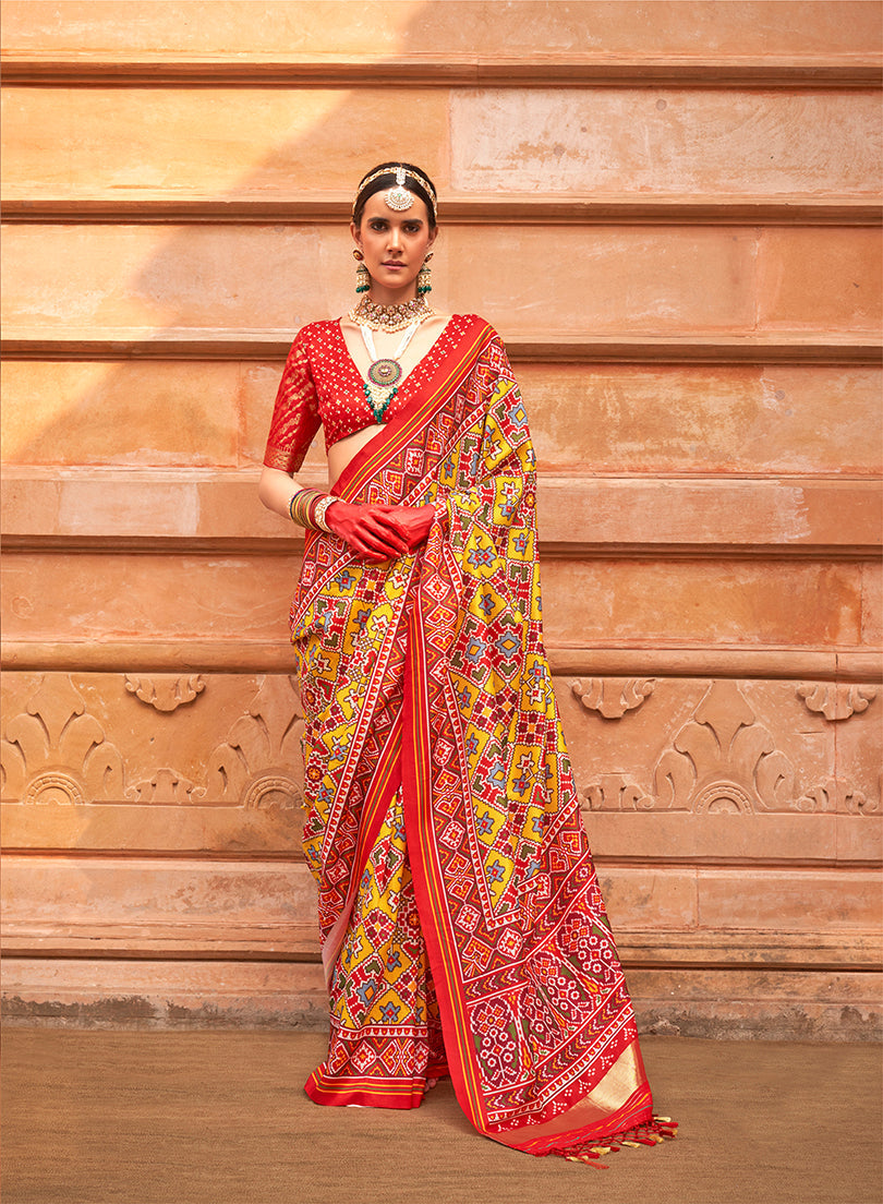 Model wearing a vibrant multi-colour silk patola print saree for ceremonial events