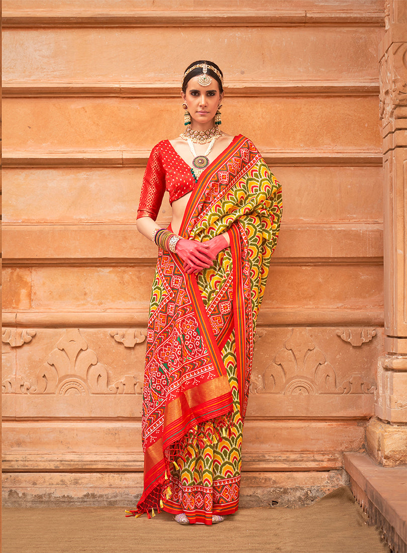 Mustard silk saree with traditional Patola print details