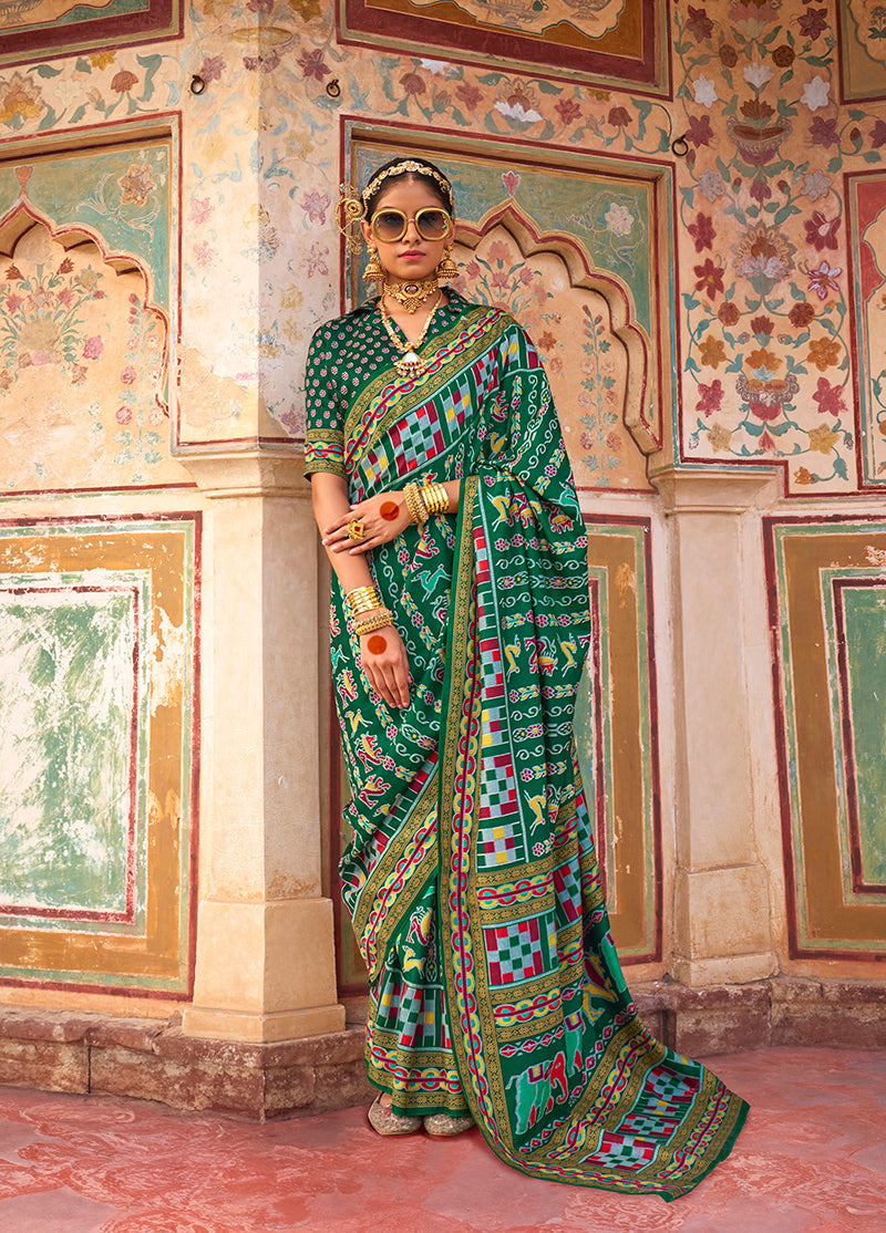 Dark green silk saree with beautiful Patola print detailing.