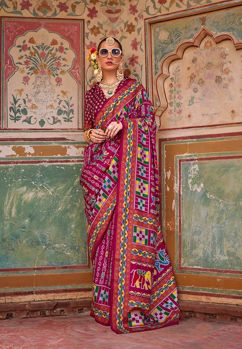 Burgundy silk saree featuring intricate Patola print