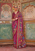 Burgundy silk saree featuring intricate Patola print