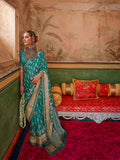 Aqua blue mercerized sigma silk saree with a luminous finish and elegant drape