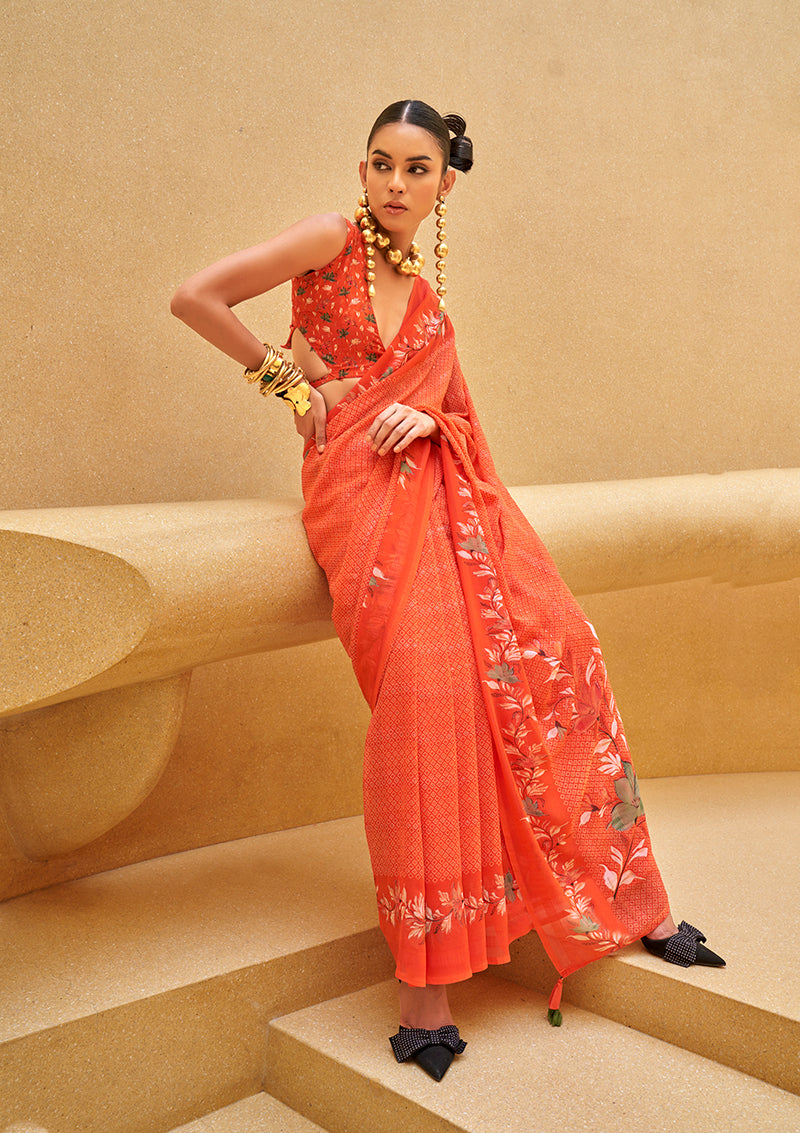 Salmon colored georgette saree with floral prints, perfect for contemporary ethnic events
