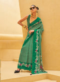 Green contemporary georgette saree with modern prints and fluid drape