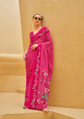 A beautiful Rani Pink printed georgette contemporary saree draped elegantly.