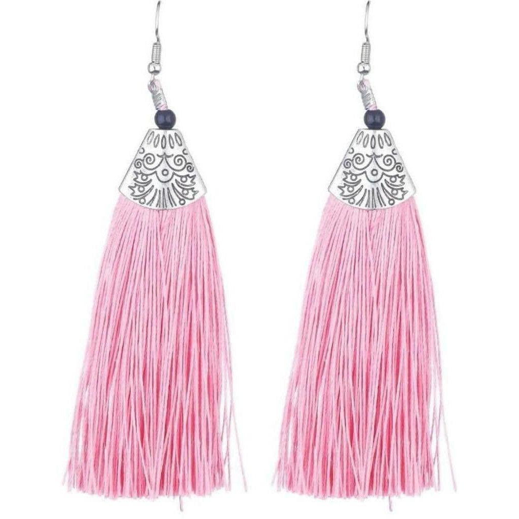 Close up of long pink yarn tassel earrings from the Muskan collection featuring handcrafted traditional design.