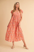 A romantic multi-color floral midi dress with puff sleeves and square neck