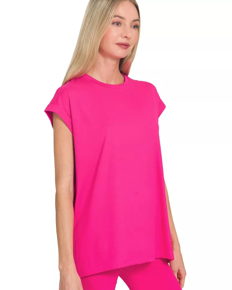 Woman wearing a bright pink outfit on a white background