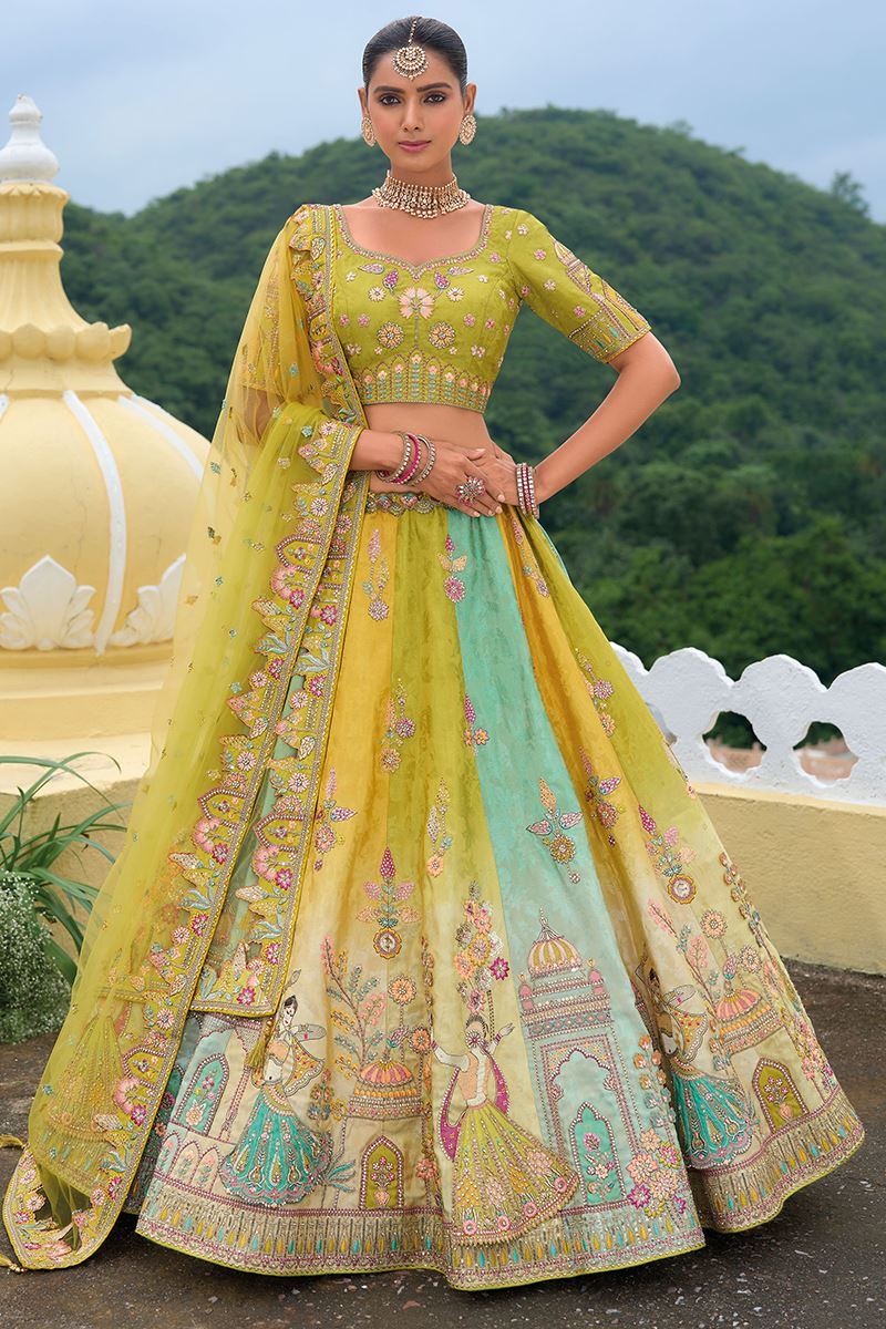 Model wearing a multi-colored silk bridal lehenga choli with intricate khatli embroidery and stone work