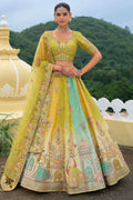 Model wearing a multi-colored silk bridal lehenga choli with intricate khatli embroidery and stone work