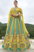 Vibrant parrot green silk readymade lehenga choli with detailed khatli embroidery.