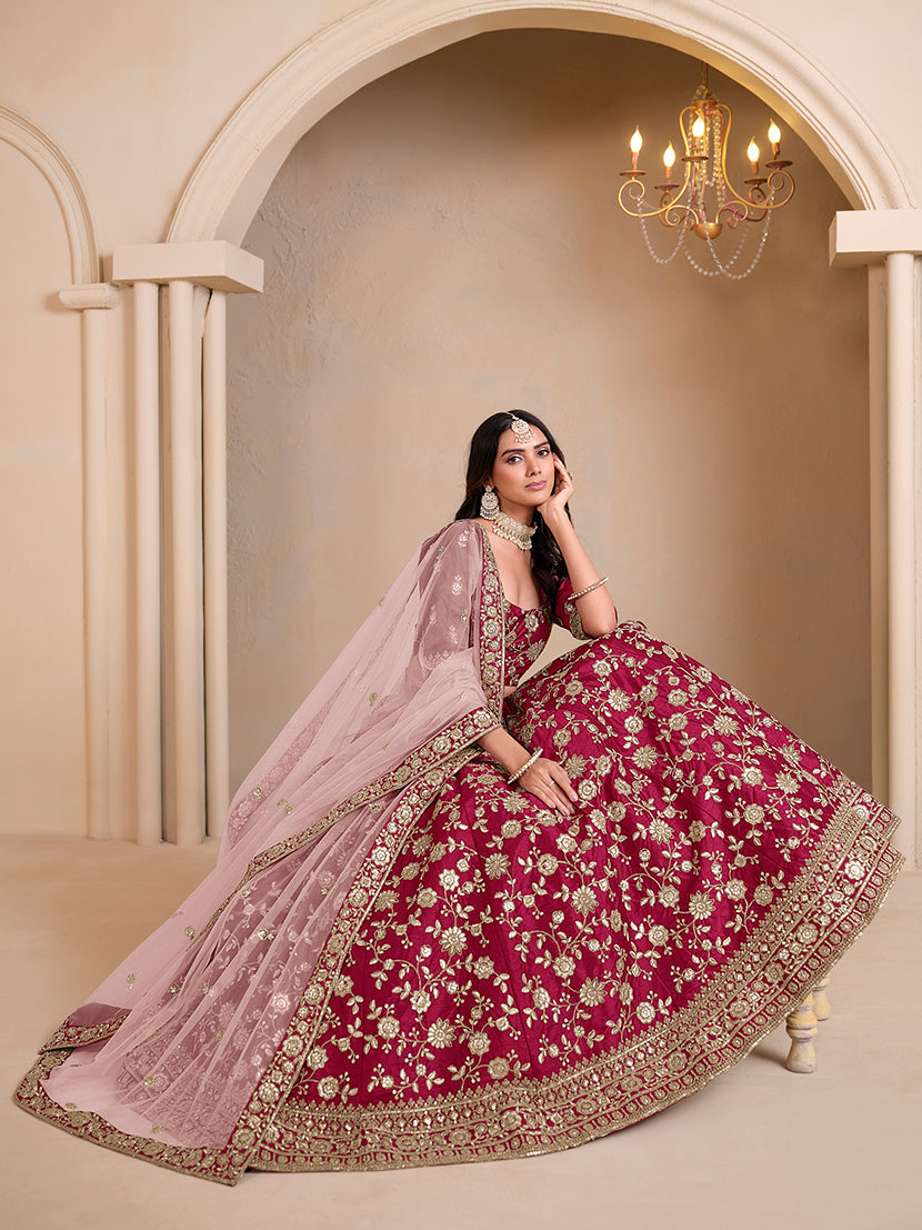 Magenta embroidered art silk designer lehenga choli with detailed ethnic embroidery.