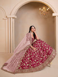 Magenta embroidered art silk designer lehenga choli with detailed ethnic embroidery.
