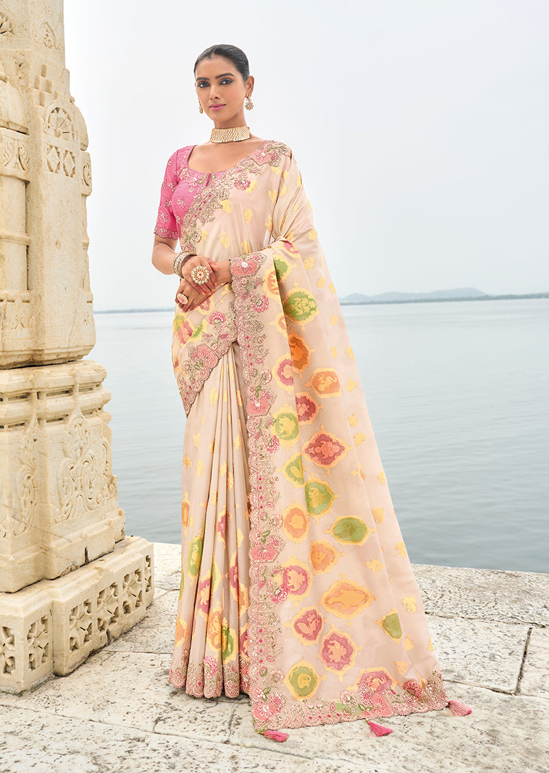 Beige viscose tissue silk saree with intricate embroidery and cutwork border