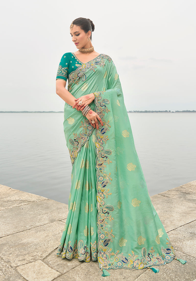 Elegant turquoise viscose tissue silk saree with intricate cutwork border