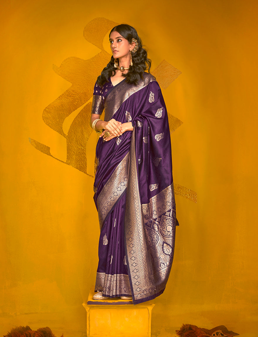 Dark purple silk blend saree with intricate gold zari weaving and two-toned fabric texture