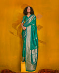Turquoise silk saree with intricate gold zari weaving and two-toned finish