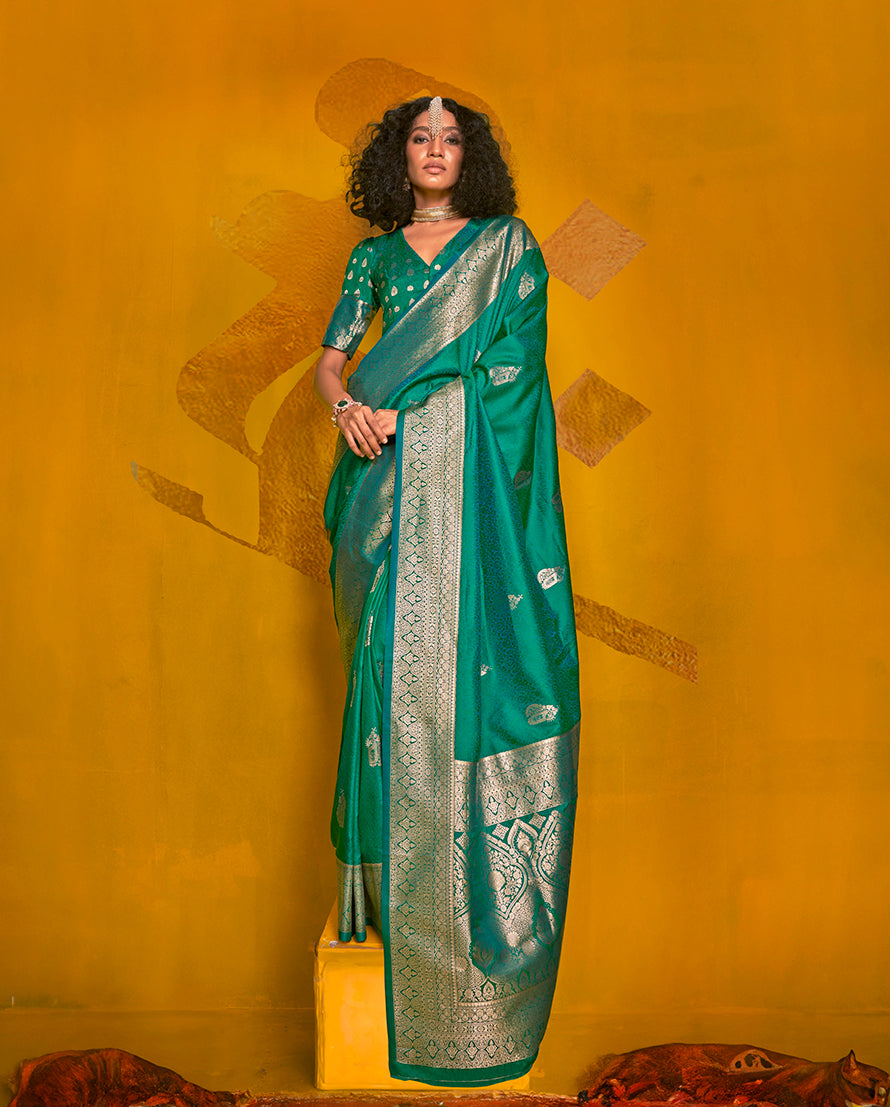 Turquoise silk saree with intricate gold zari weaving and two-toned finish